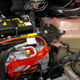 The 12V battery nestled in a Tesla Model 3. These batteries often fail in EVs, as they don’t draw high current from the lead-acid battery on starting like an ICE does. It’s believed this high current draw regularly breaks up deposits that build up on the plates of the battery, helping it last longer. EVs don’t do this, and 12V battery failures are common.